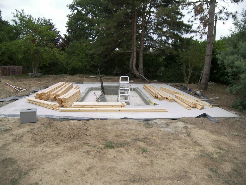 Dalle béton avec fosse de visite prête pour un garage bois
