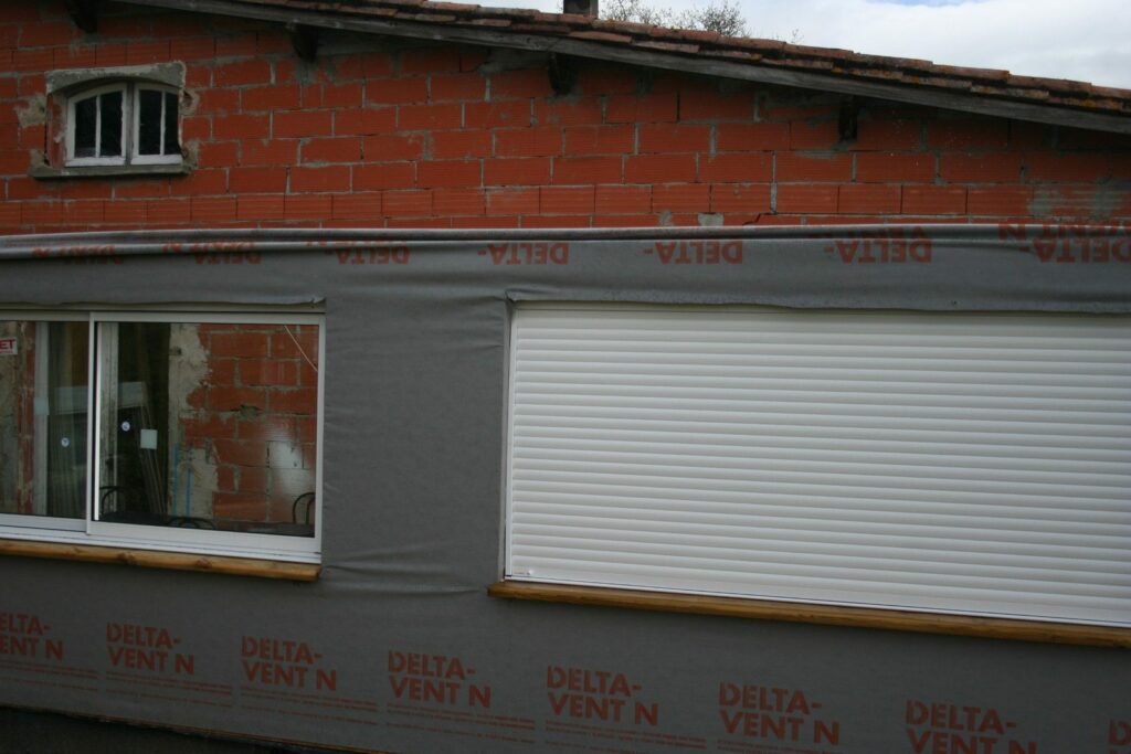 Extension type véranda en ossature bois avec baies coulissantes (1)